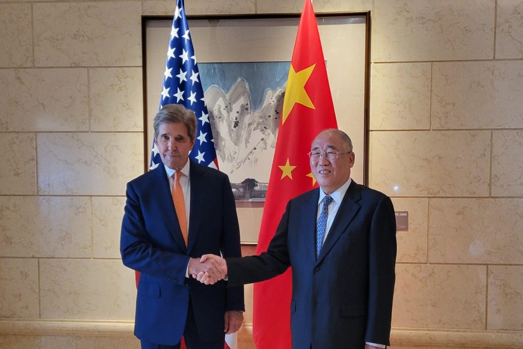 John Kerry with his Chinese counterpart, Xie Zhenhua.