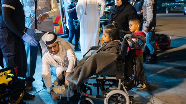Emirati humanitarian team receiving Gaza Children